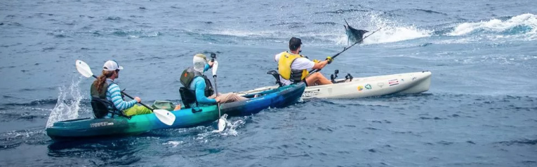 Adventuring in the waves ride double kayak